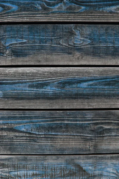 Oude houten planken met resten van blauwe verf — Stockfoto