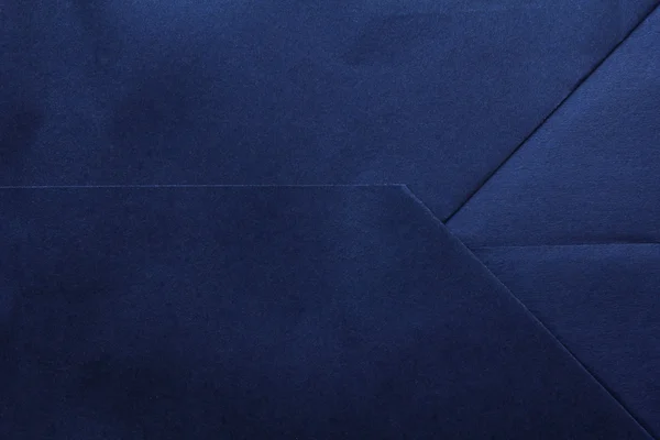 Marinblå vikta pappers bakgrund eller konsistens — Stockfoto