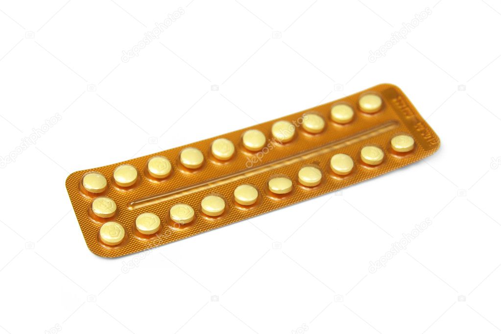 Contraceptive pills on white background with selective focus