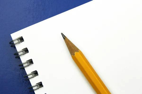 Pencil on blank notebook — Stock Photo, Image