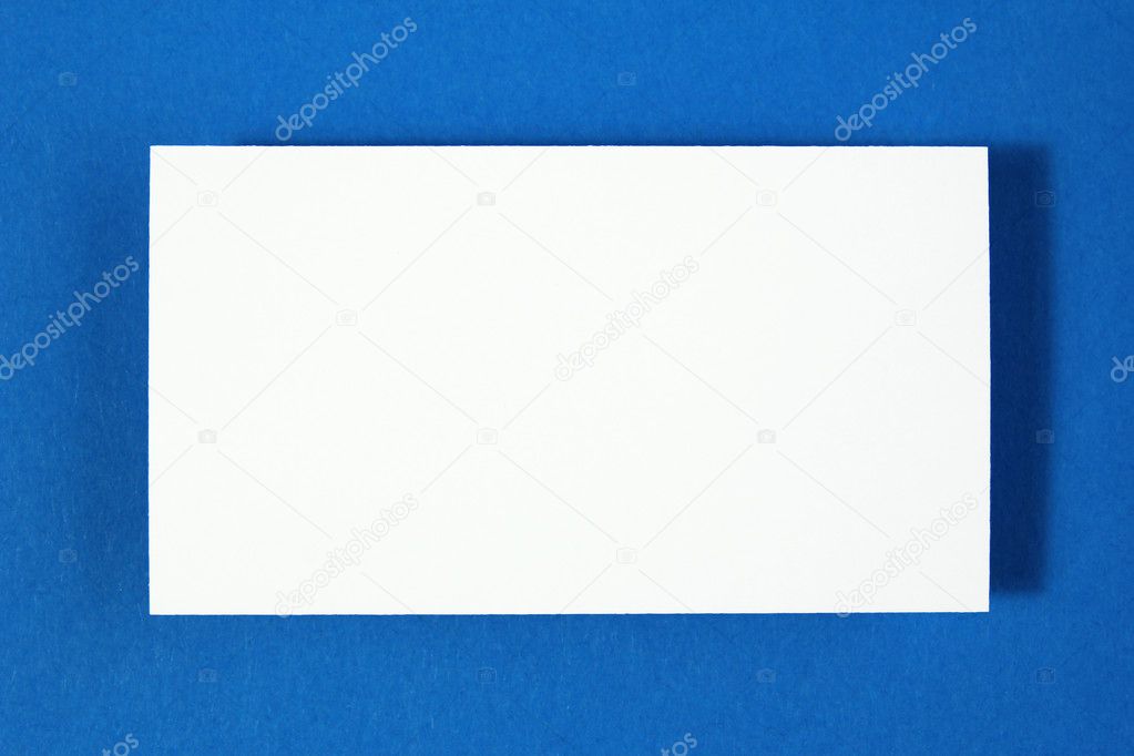 Blank business card on blue paper background