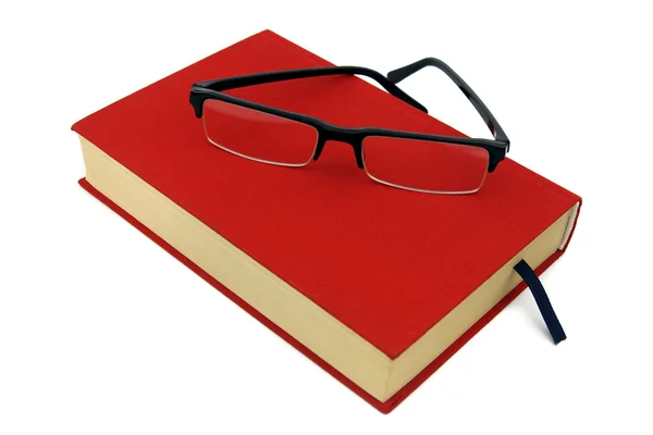 Book with red cover and glasses isolated on white background — Stock Photo, Image