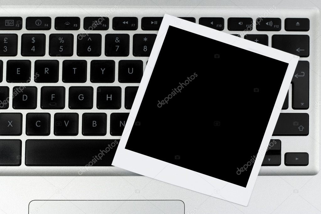 Blank instant photo on laptop
