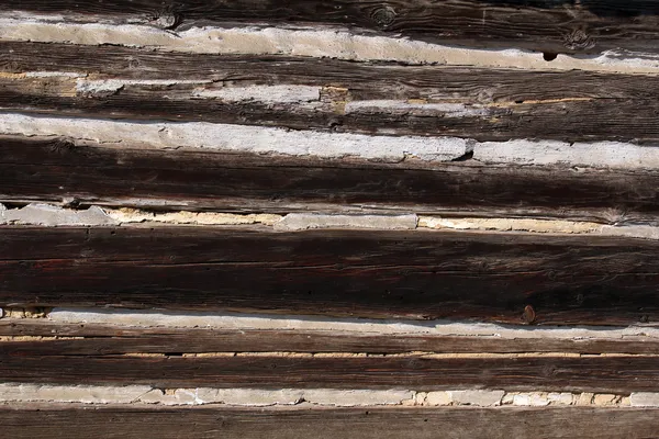Close-up van oude houten huis muur — Stockfoto