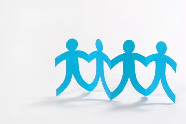 Teamwork, blue paper people on white — Stock Photo, Image