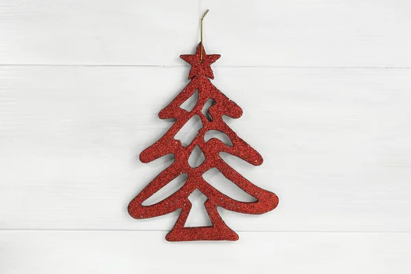 Red christmas tree on white wooden background — Stock Photo, Image