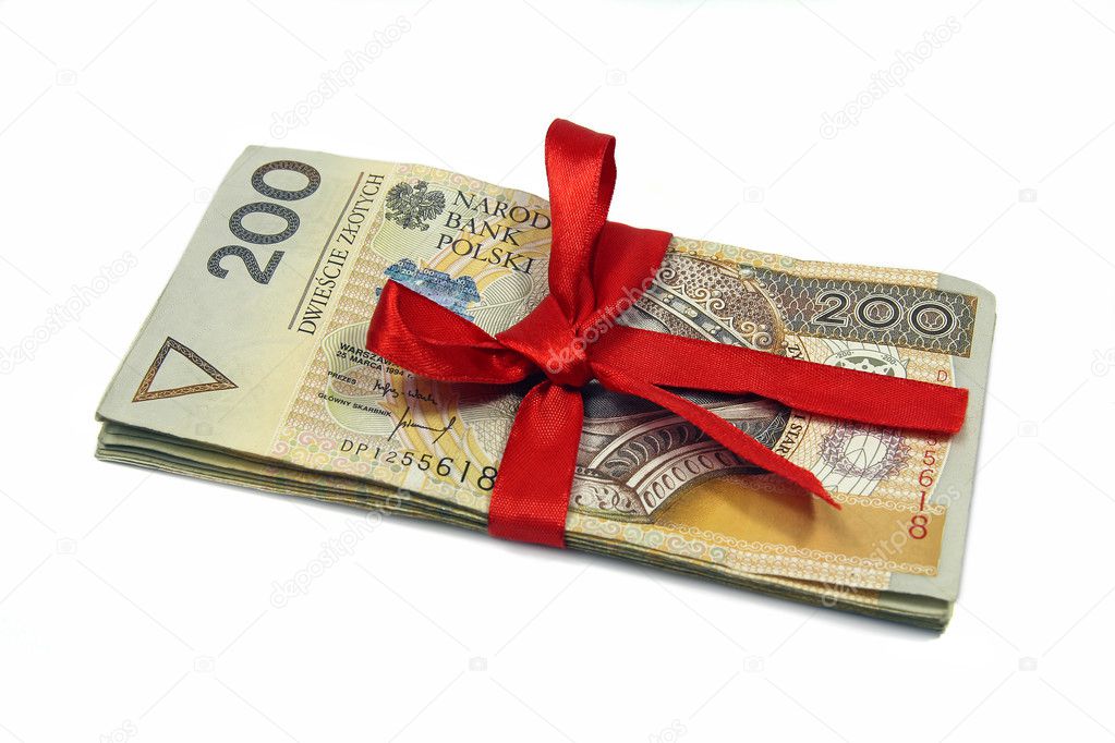 Polish zloty banknotes tied with red ribbon isolated on white