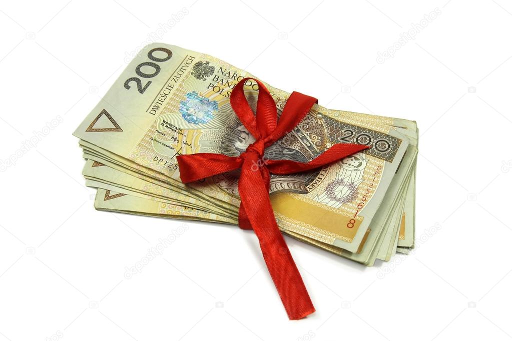 Polish money banknotes tied with red ribbon isolated on white