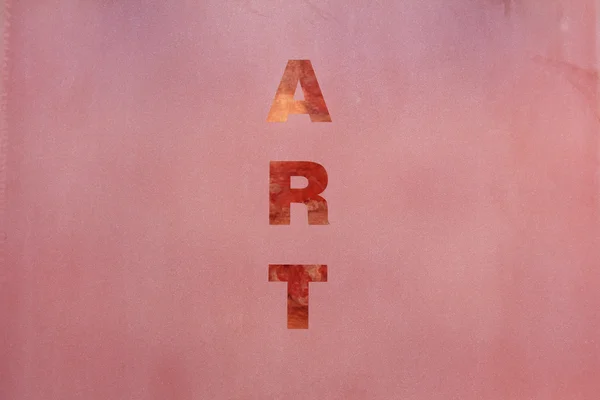 Искусство слово на розовой поверхности — стоковое фото