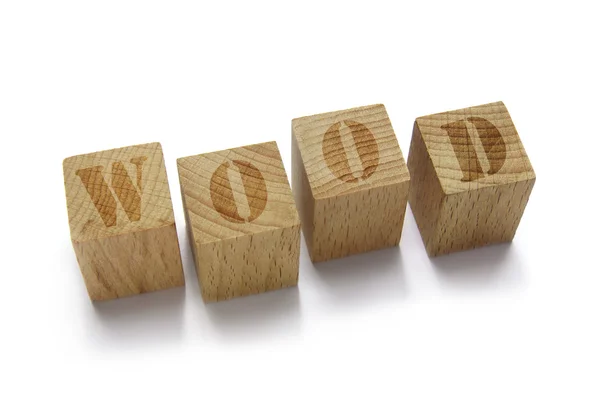 Деревянное слово на деревянных кубиках — стоковое фото