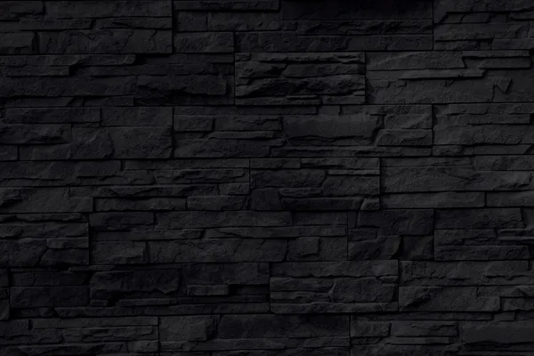 Latar belakang atau tekstur dinding batu hitam — Stok Foto