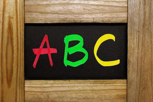 ABC letters on wooden frame — Stock Photo, Image