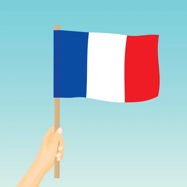 Рука Тримає Прапор Франції Проти Синього Векторного Зображення — стоковий вектор
