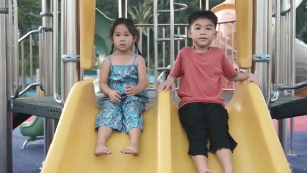 Asian Child Smiling Playing Slider Bar Toy Outdoor Playground Happy — Stock Video