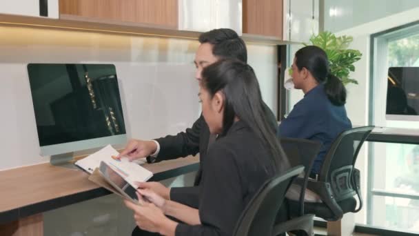 Two Business People Having Meeting Together Discussing Charts Graphs Showing — Stock Video