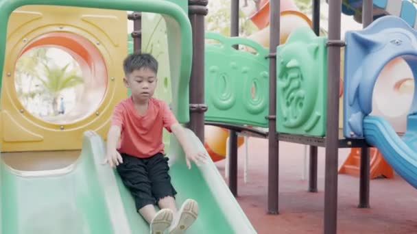 Asian Child Smiling Playing Slider Bar Toy Outdoor Playground Happy — Stock Video