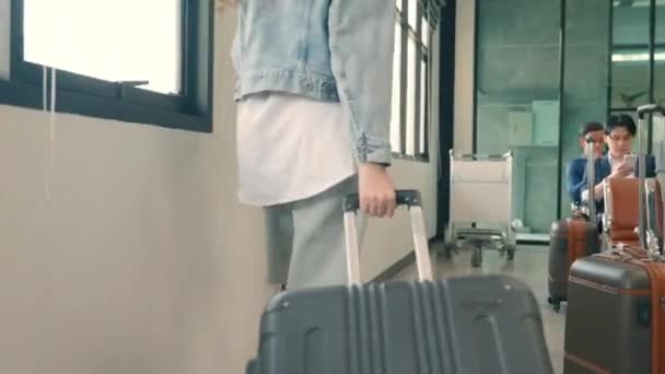 Female Traveler Walking Pulling Suitcase Airport Terminal Sitting Chair Waiting — Stock Video