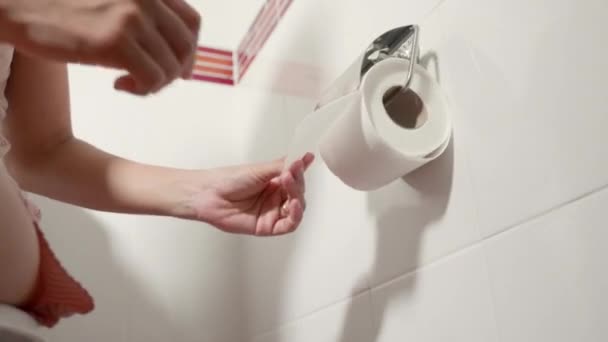 Closeup Hand Pulling Toilet Paper Roll Holder Wipe Woman Sitting — Stock Video