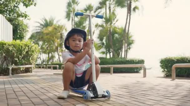 Tired Child Boy Sitting Ride Scooter Park Long Workout Sad — Vídeo de Stock