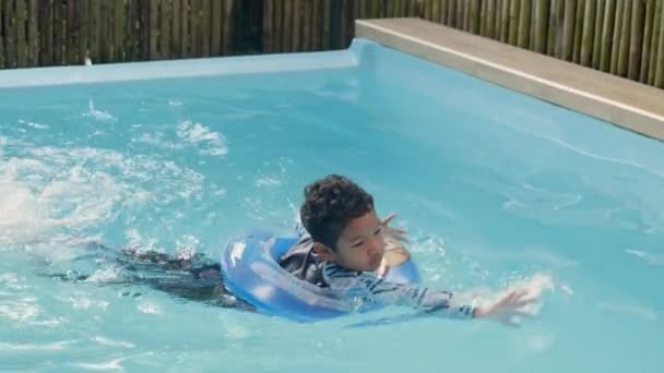 Happy Young Boy Curly Hair Inflatable Ring Having Fun Water — Vídeo de stock