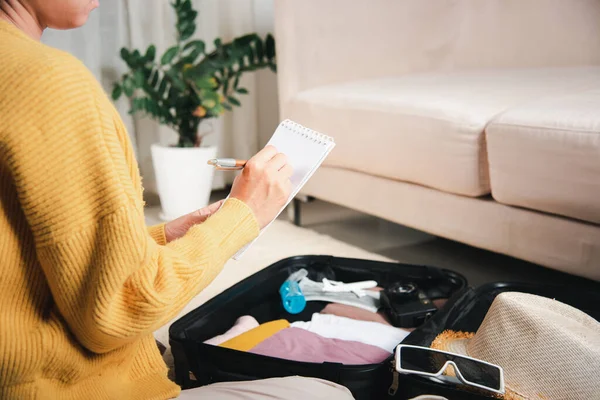 Making Check List Things Pack Travel Woman Writing Paper Take — Fotografia de Stock