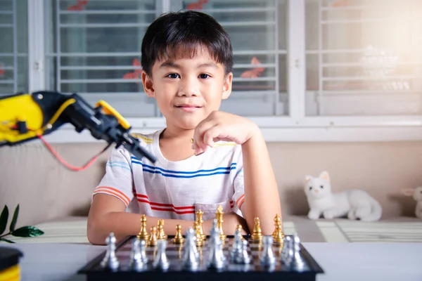 Premium Photo  Asian little boy programming code to robot machine