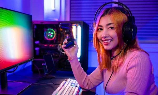 Asian Cute Girl Streaming Play Game Online Using Controller and Talking  with Fan Club from Microphone and Headset in Gamer Neon Stock Photo - Image  of internet, cheerful: 282549384