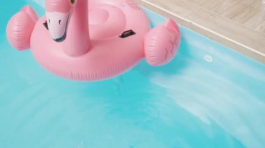Beautiful sporty slim woman legs relaxing in water swimming pool spa, Enjoying suntan summer time, Female splashing feet in turquoise blue waters, Vacation feeling concept, Top view