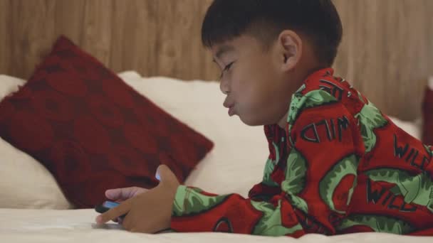 Kid Watching Videos Cartoons Online Bedroom Home Little Asian Boy — Video