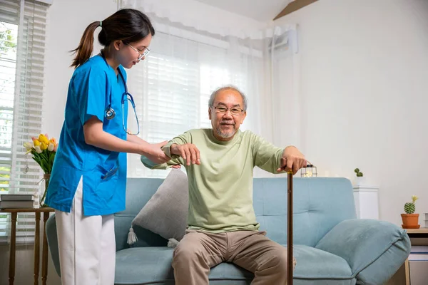 Young Woman Help Support Orthopedic Patients Get Walking Cane Home — Stock Photo, Image