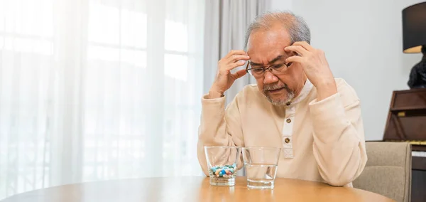 Asian Elderly Man Sick Have Headache Looking Pill Glass Home — Foto Stock