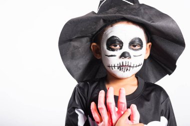 Halloween Kid. Portrait of Asian little kid boy wearing skeleton costume studio shot isolated white background, Child man horror face painting make up for scary, Happy halloween day concept