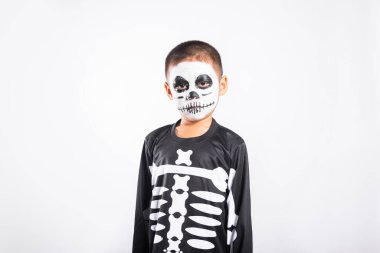 Halloween Kid. Portrait of Asian little kid boy wearing skeleton costume studio shot isolated white background, Child man horror face painting make up for scary, Happy halloween day concept