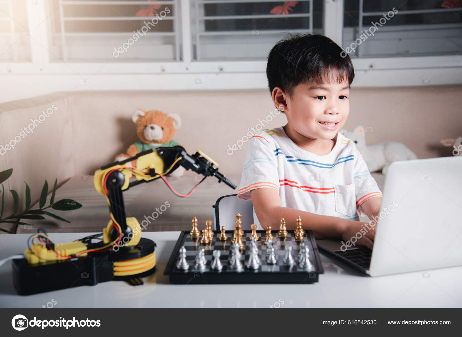 Premium Photo  Asian little boy programming code to robot machine