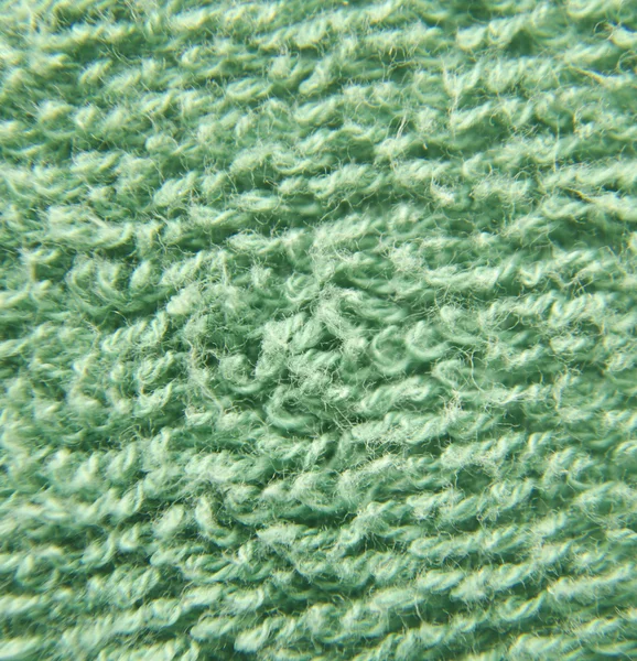 Green fluffy cloth close view — Stock Photo, Image