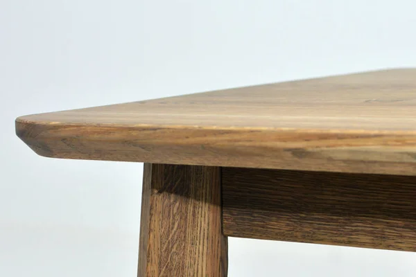 Wooden dinner table surface. Natural wood furniture close view background. Solid wood table top