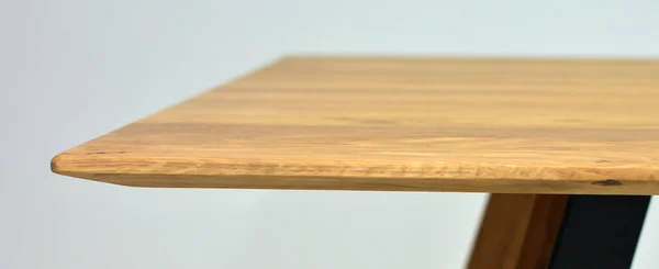 Wooden table surface. Natural wood furniture close view photo background. Solid wood table top and legs. Eco furniture production, manufacturing