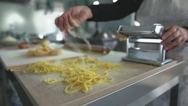 Close Female Hands Preparing Fresh Fettucine Pasta Using Traditional Machine — Stock Video