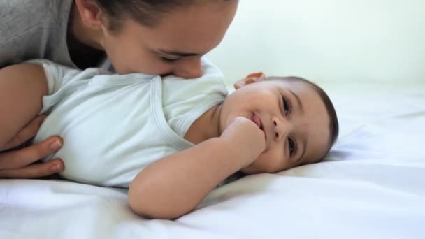 Happy Mother Playing Her Baby Lying Together Bed — Stock Video