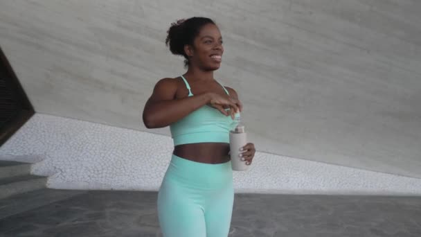 Young African Woman Taking Break Drinking Water Workout Exercises Outdoor — Stock Video