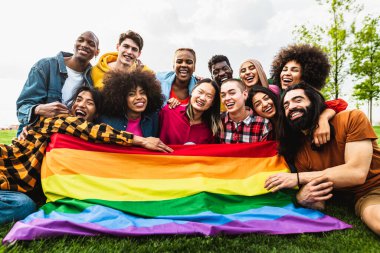 Happy diverse young friends celebrating gay pride festival - LGBTQ community concept
