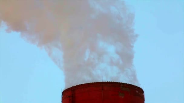 Smoke or steam stack on blue sky background — Stock Video