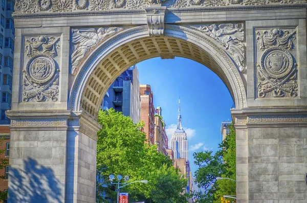 Washington Square Arch and the Empire State Building in the dist