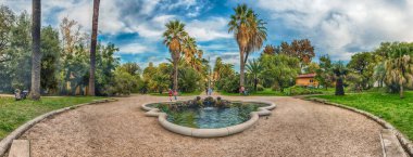 ROME - NOVEMBER 21, 2021: Scenic fountain inside the historical Botanical Garden of Rome, Italy