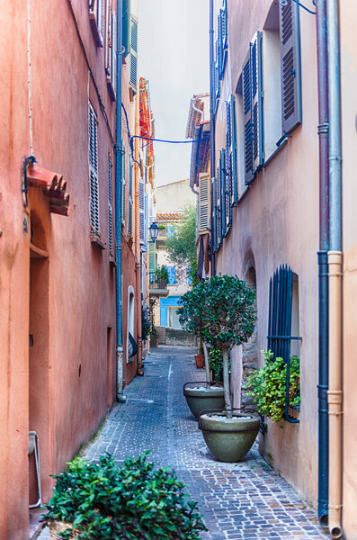 Walking in the picturesque streets of Saint-Tropez, Cote d'Azur, France. The town is worldwide famous resort for the European and American jet set and tourists