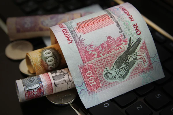 Uae dirhams on top of keyboard — Stock Photo, Image