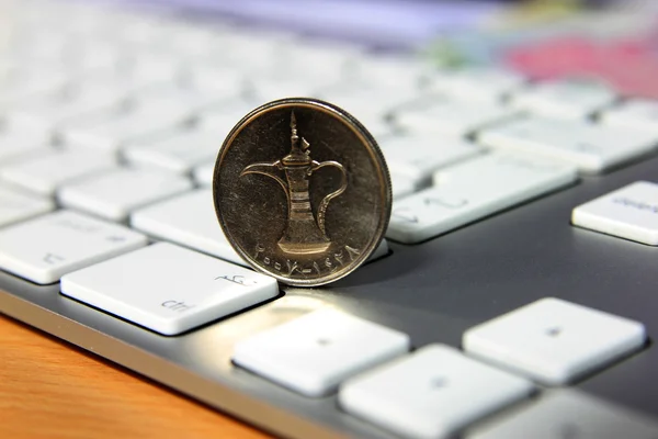 Online transaction concept, dirhams on top of keyboard — Stock Photo, Image