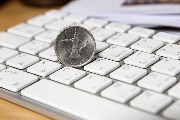 Online transaction concept, dirhams on top of keyboard — Stock Photo, Image