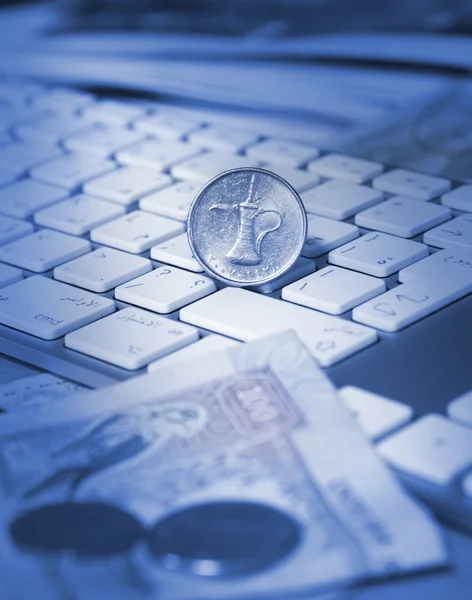 Online transaction concept, dirhams on top of keyboard — Stock Photo, Image