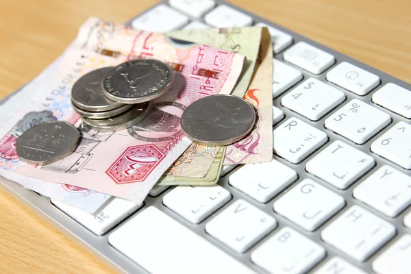 Online transaction concept - dirhams on top of keyboard — Stock Photo, Image